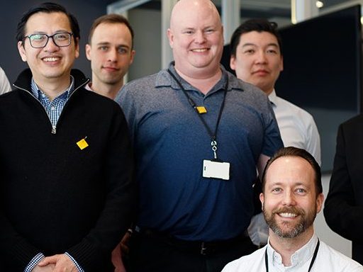 OAGBC staff pose wearing moose hide patches